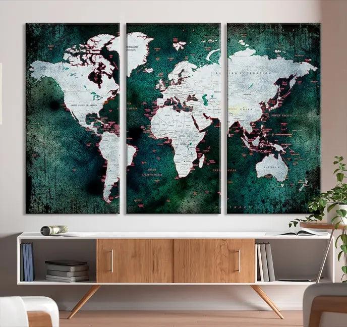 A stylish living room showcases a triptych 'Canvas World Map' on gallery-wrapped, museum-quality canvases decorating the wall.