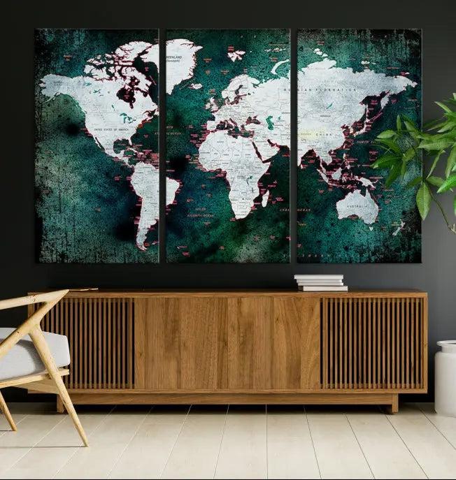 A stylish living room showcases a triptych 'Canvas World Map' on gallery-wrapped, museum-quality canvases decorating the wall.