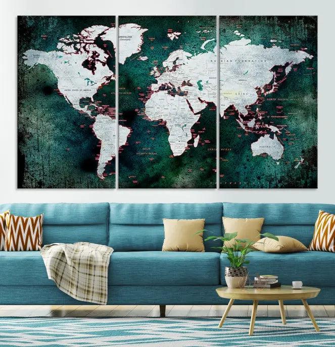 A stylish living room showcases a triptych 'Canvas World Map' on gallery-wrapped, museum-quality canvases decorating the wall.