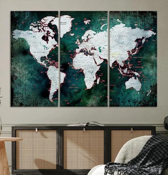 A stylish living room showcases a triptych 'Canvas World Map' on gallery-wrapped, museum-quality canvases decorating the wall.