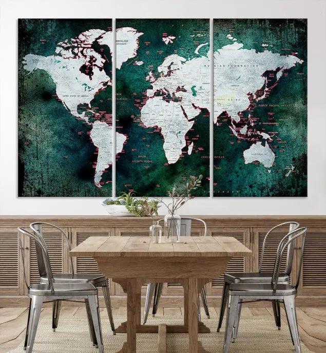 A stylish living room showcases a triptych 'Canvas World Map' on gallery-wrapped, museum-quality canvases decorating the wall.