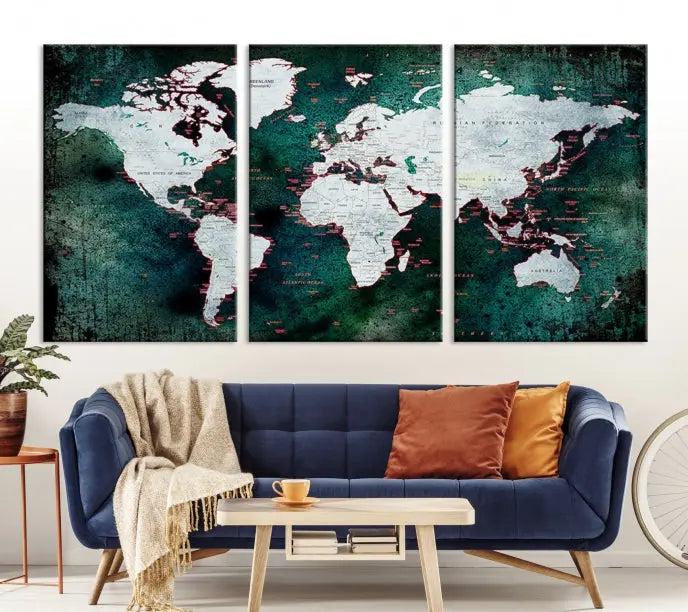 A stylish living room showcases a triptych 'Canvas World Map' on gallery-wrapped, museum-quality canvases decorating the wall.