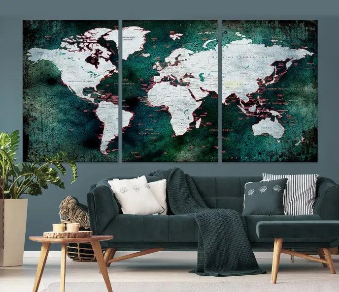 A stylish living room showcases a triptych 'Canvas World Map' on gallery-wrapped, museum-quality canvases decorating the wall.