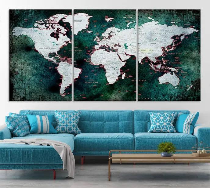 A stylish living room showcases a triptych 'Canvas World Map' on gallery-wrapped, museum-quality canvases decorating the wall.