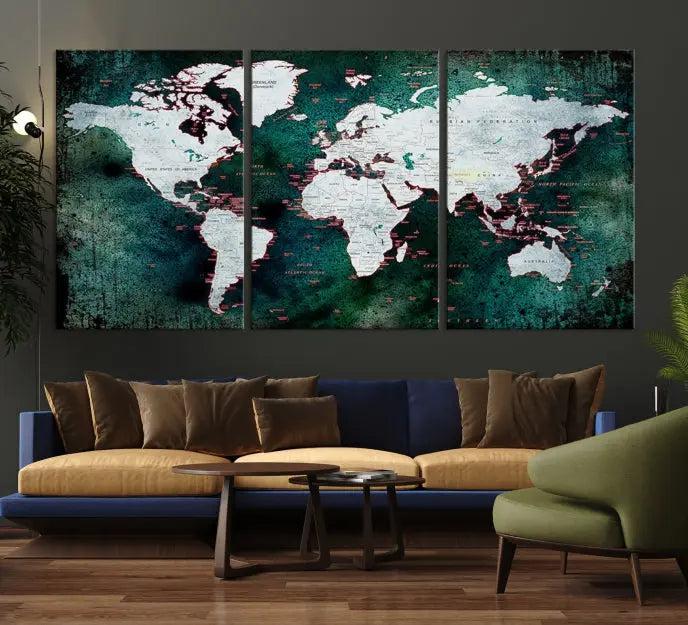 A stylish living room showcases a triptych 'Canvas World Map' on gallery-wrapped, museum-quality canvases decorating the wall.