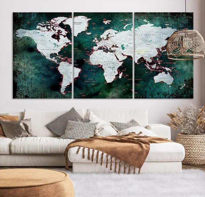 A stylish living room showcases a triptych 'Canvas World Map' on gallery-wrapped, museum-quality canvases decorating the wall.