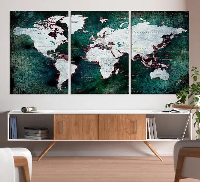 A stylish living room showcases a triptych 'Canvas World Map' on gallery-wrapped, museum-quality canvases decorating the wall.