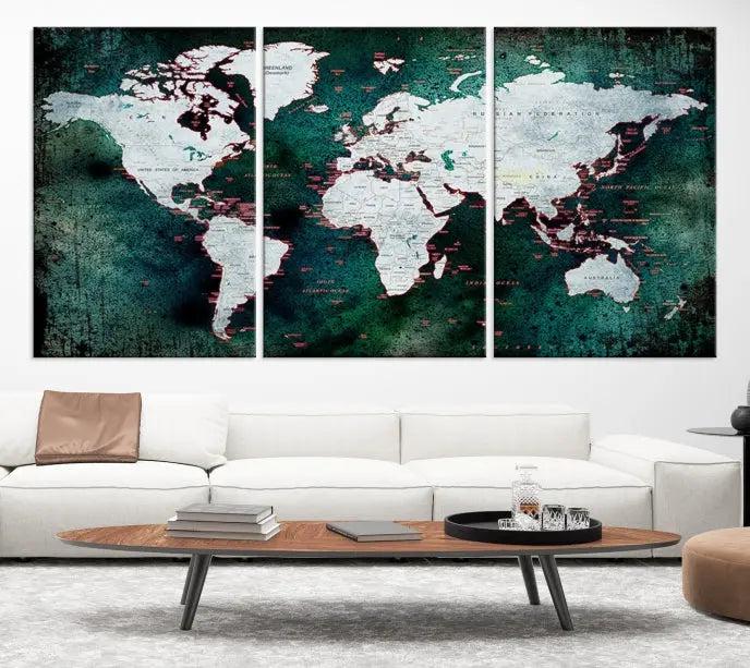 A stylish living room showcases a triptych 'Canvas World Map' on gallery-wrapped, museum-quality canvases decorating the wall.