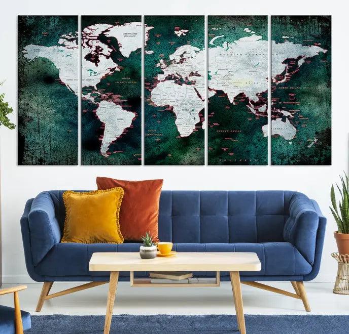 A stylish living room showcases a triptych 'Canvas World Map' on gallery-wrapped, museum-quality canvases decorating the wall.