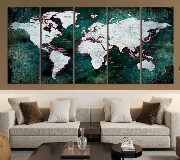 A stylish living room showcases a triptych 'Canvas World Map' on gallery-wrapped, museum-quality canvases decorating the wall.