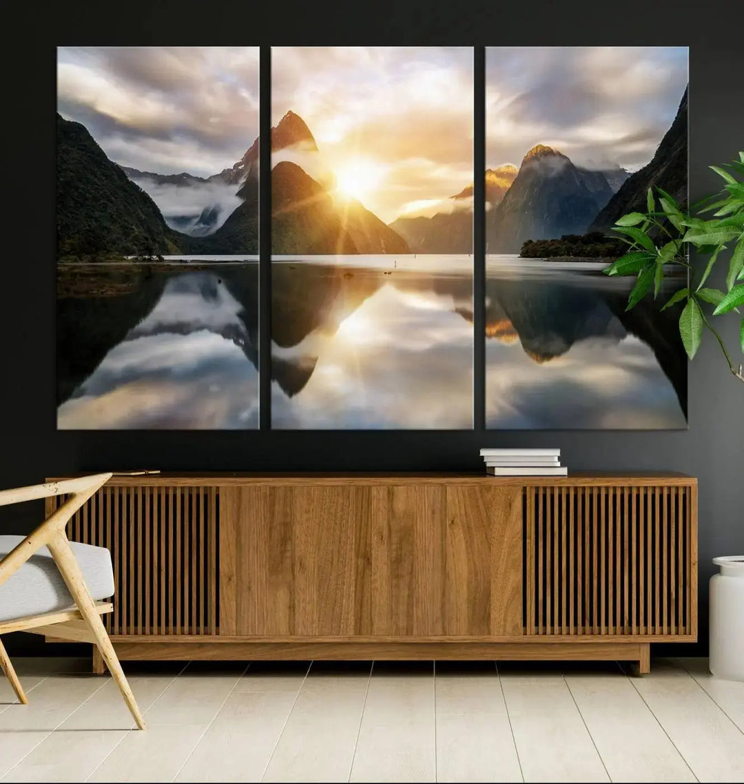 A captivating natural landscape wall art canvas print features a serene lake and majestic mountains illuminated by a dramatic sunset. This gallery-wrapped image is printed on museum-quality polycotton canvas, ensuring its timeless charm for years to come.