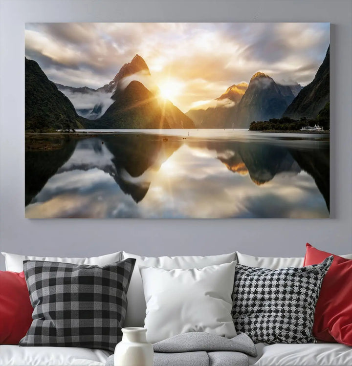 A captivating natural landscape wall art canvas print features a serene lake and majestic mountains illuminated by a dramatic sunset. This gallery-wrapped image is printed on museum-quality polycotton canvas, ensuring its timeless charm for years to come.