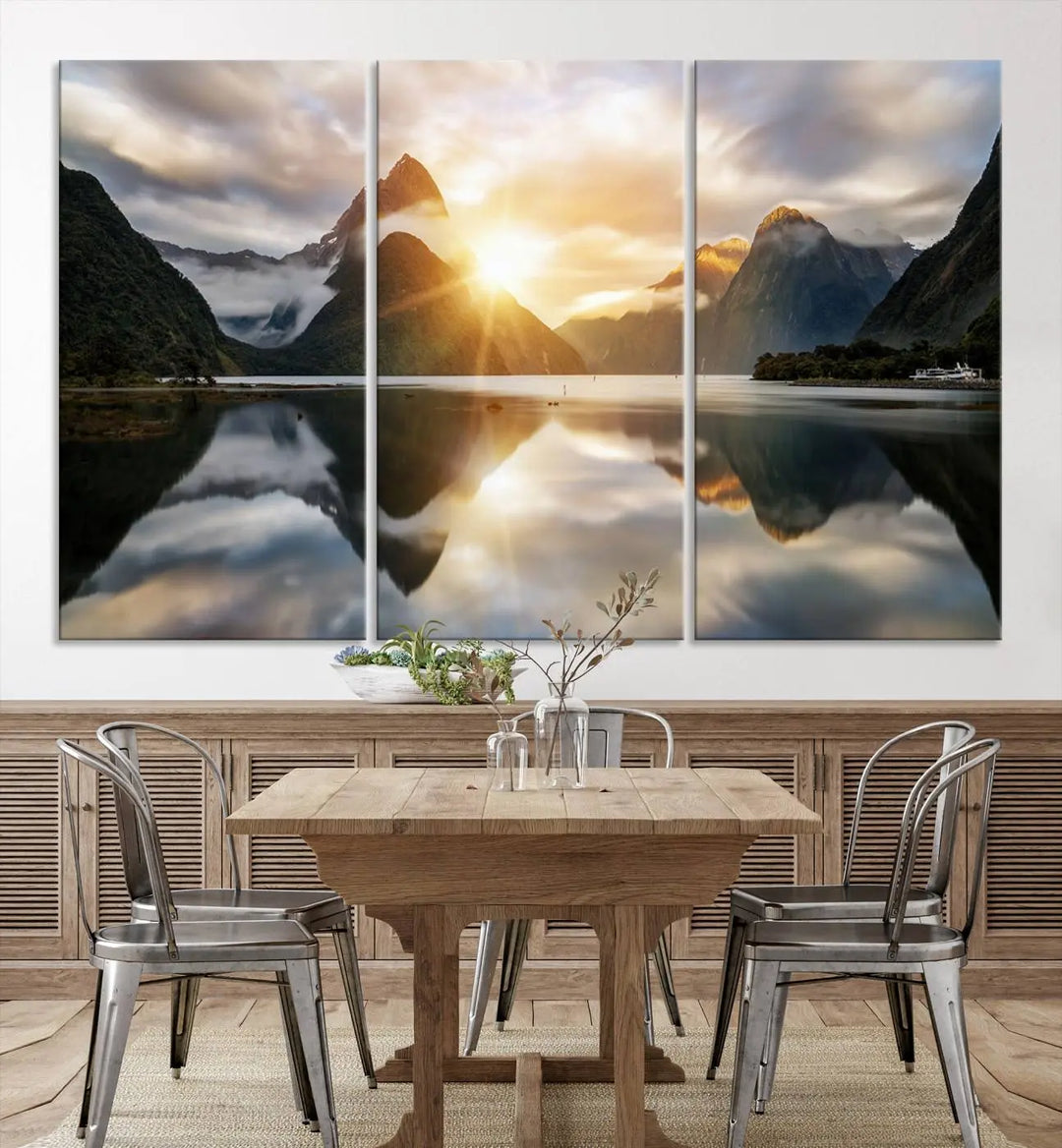 A captivating natural landscape wall art canvas print features a serene lake and majestic mountains illuminated by a dramatic sunset. This gallery-wrapped image is printed on museum-quality polycotton canvas, ensuring its timeless charm for years to come.