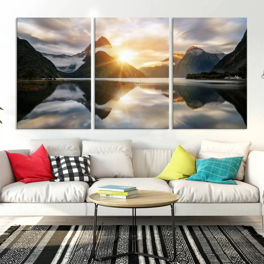 A captivating natural landscape wall art canvas print features a serene lake and majestic mountains illuminated by a dramatic sunset. This gallery-wrapped image is printed on museum-quality polycotton canvas, ensuring its timeless charm for years to come.