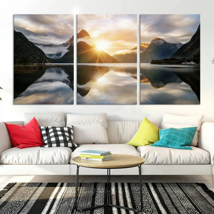 A captivating natural landscape wall art canvas print features a serene lake and majestic mountains illuminated by a dramatic sunset. This gallery-wrapped image is printed on museum-quality polycotton canvas, ensuring its timeless charm for years to come.