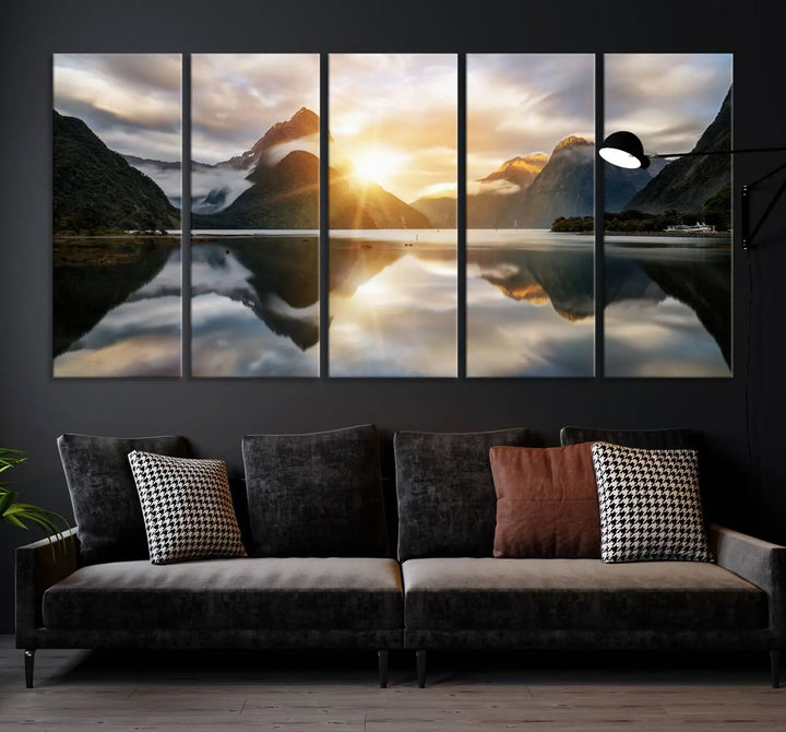 A captivating natural landscape wall art canvas print features a serene lake and majestic mountains illuminated by a dramatic sunset. This gallery-wrapped image is printed on museum-quality polycotton canvas, ensuring its timeless charm for years to come.