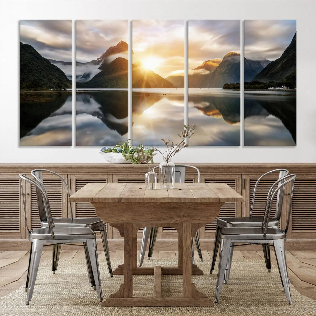 A captivating natural landscape wall art canvas print features a serene lake and majestic mountains illuminated by a dramatic sunset. This gallery-wrapped image is printed on museum-quality polycotton canvas, ensuring its timeless charm for years to come.