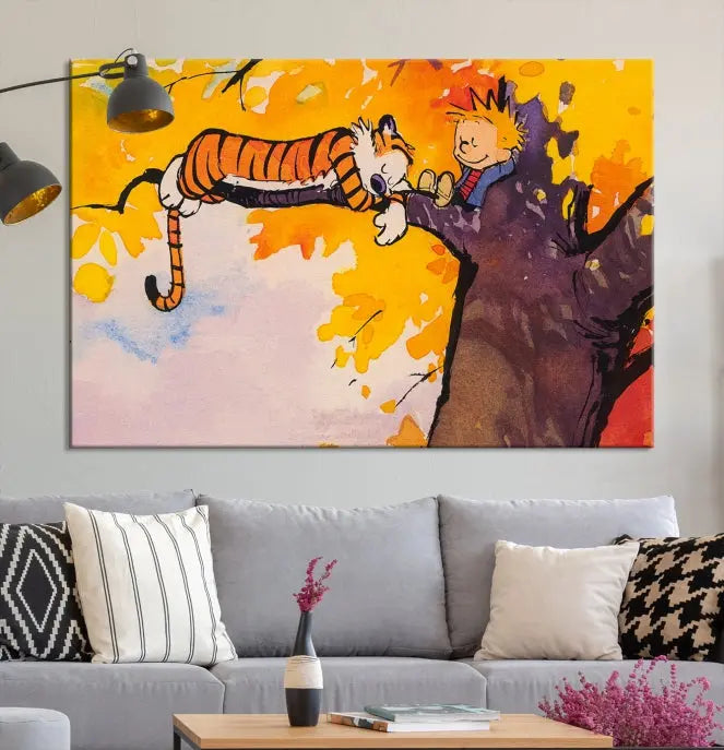 The Cartoon Wall Art Calvin and Hobbes Canvas Print features a boy and a tiger lounging on a tree branch amidst vibrant autumn leaves. Crafted on museum-quality canvases with UV-protective coating, this artwork elevates any room.