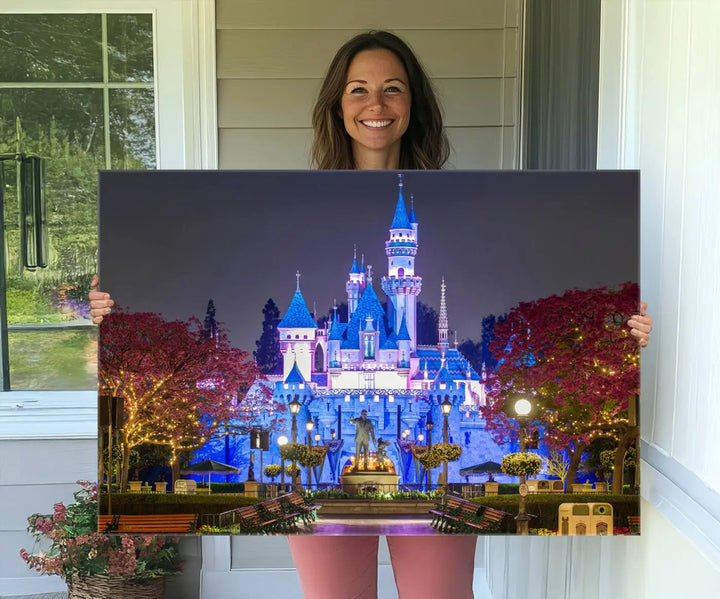 The Large Disney Castle Canvas Print captures a brightly lit castle at night.