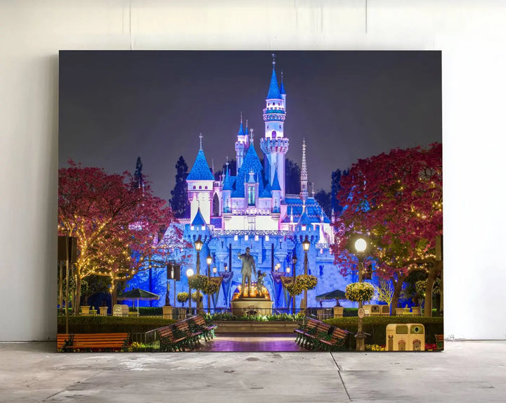 The Large Disney Castle Canvas Print captures a brightly lit castle at night.