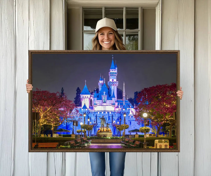 The Large Disney Castle Canvas Print captures a brightly lit castle at night.