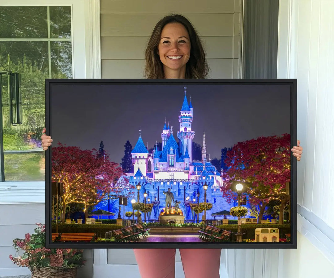 The Large Disney Castle Canvas Print captures a brightly lit castle at night.