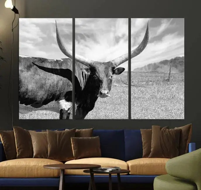 A black and white image of a longhorn cow, expertly divided into three panels, is printed on high-quality poly-cotton canvas. This Cattle Wall Art Longhorn Cow Canvas Print is professionally hand-assembled. Enjoy the ease of free shipping included with your purchase for ultimate convenience.