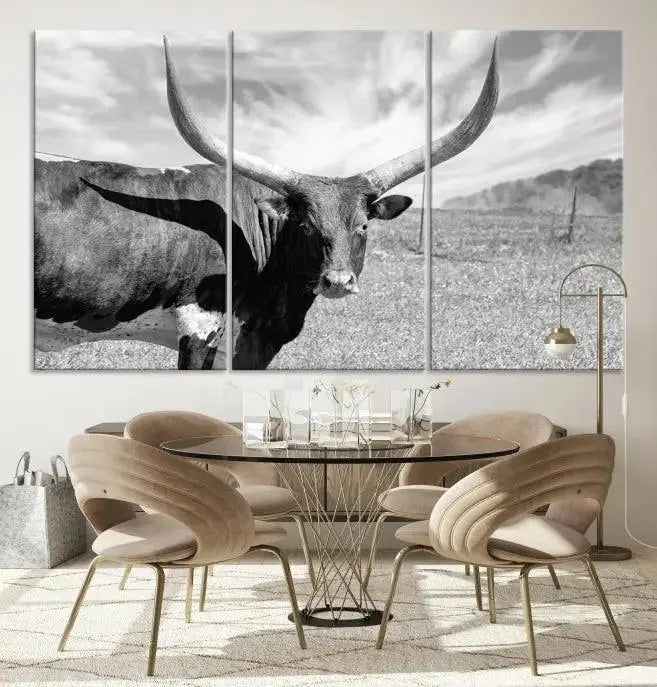 A black and white image of a longhorn cow, expertly divided into three panels, is printed on high-quality poly-cotton canvas. This Cattle Wall Art Longhorn Cow Canvas Print is professionally hand-assembled. Enjoy the ease of free shipping included with your purchase for ultimate convenience.