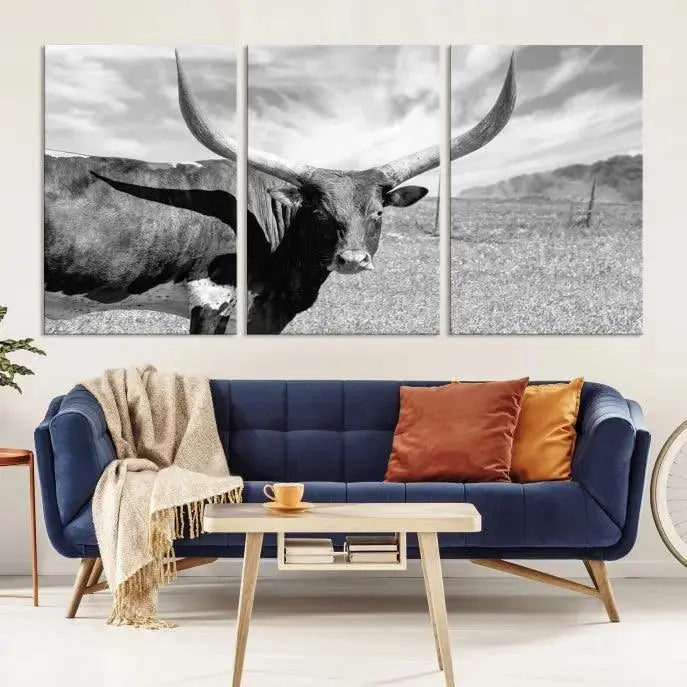 A black and white image of a longhorn cow, expertly divided into three panels, is printed on high-quality poly-cotton canvas. This Cattle Wall Art Longhorn Cow Canvas Print is professionally hand-assembled. Enjoy the ease of free shipping included with your purchase for ultimate convenience.