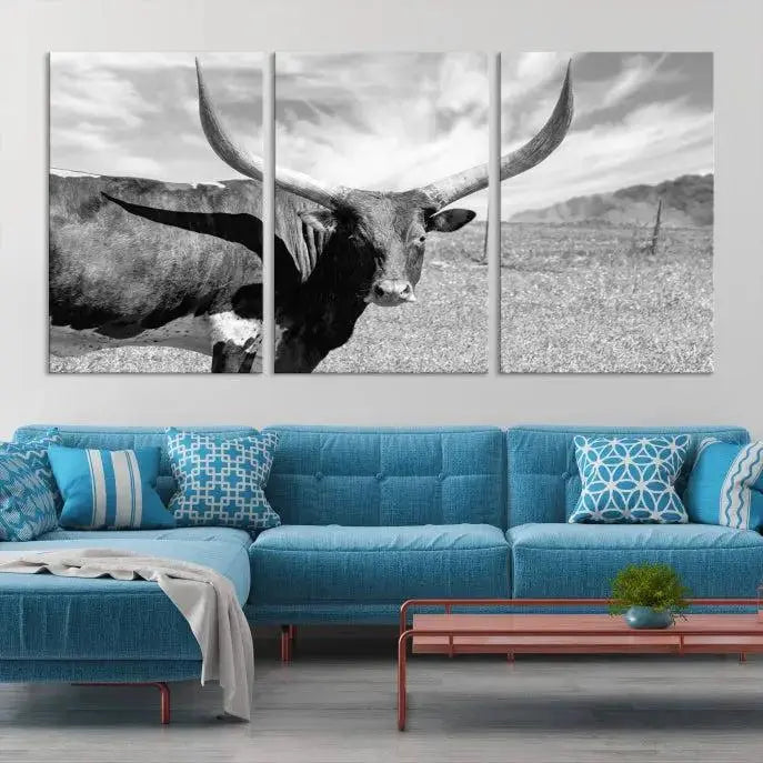 A black and white image of a longhorn cow, expertly divided into three panels, is printed on high-quality poly-cotton canvas. This Cattle Wall Art Longhorn Cow Canvas Print is professionally hand-assembled. Enjoy the ease of free shipping included with your purchase for ultimate convenience.