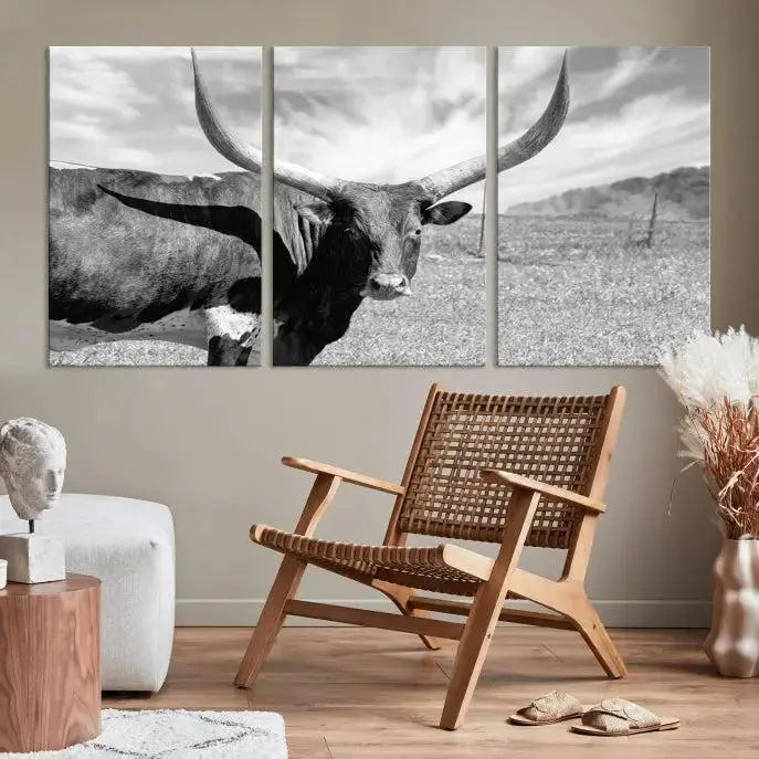 A black and white image of a longhorn cow, expertly divided into three panels, is printed on high-quality poly-cotton canvas. This Cattle Wall Art Longhorn Cow Canvas Print is professionally hand-assembled. Enjoy the ease of free shipping included with your purchase for ultimate convenience.