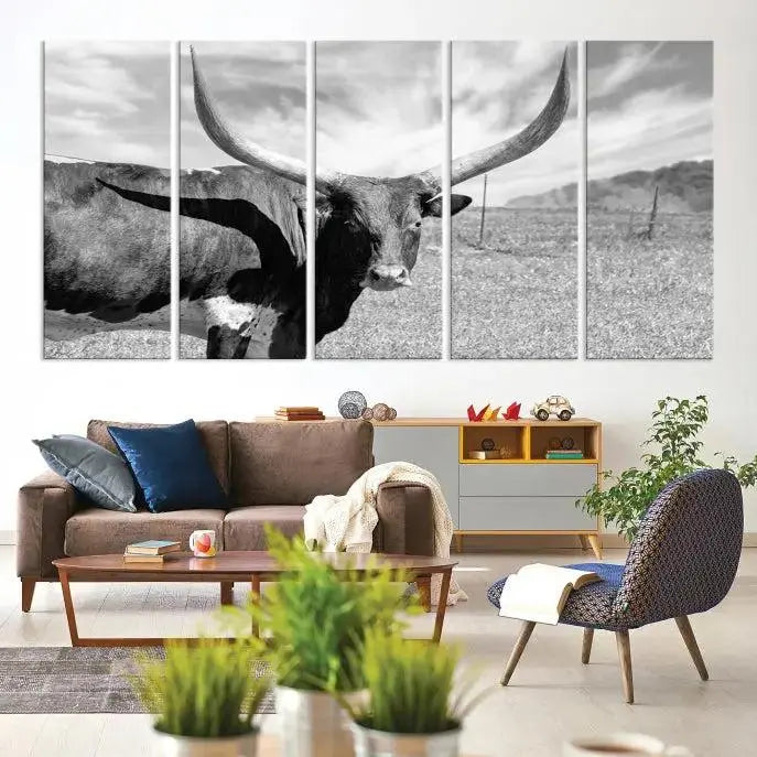 A black and white image of a longhorn cow, expertly divided into three panels, is printed on high-quality poly-cotton canvas. This Cattle Wall Art Longhorn Cow Canvas Print is professionally hand-assembled. Enjoy the ease of free shipping included with your purchase for ultimate convenience.