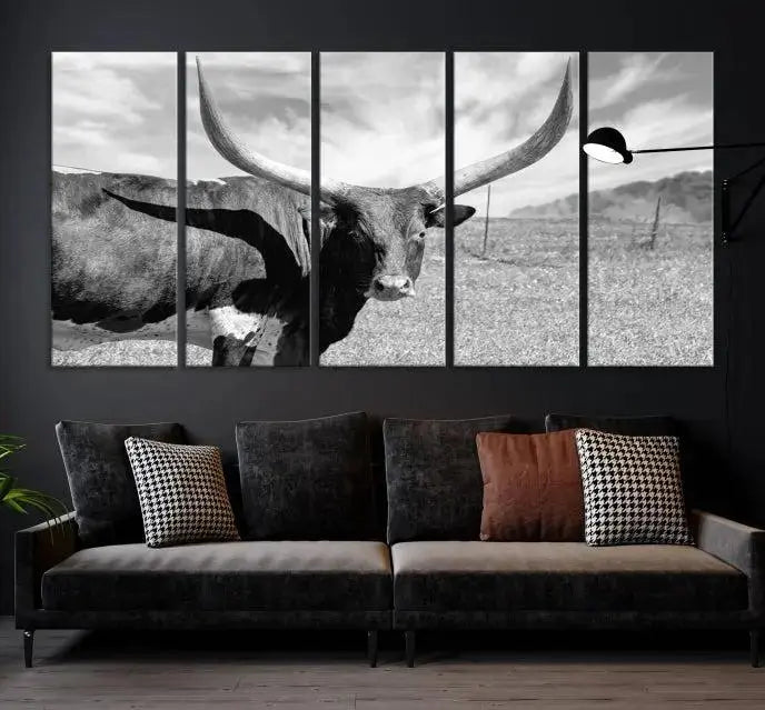 A black and white image of a longhorn cow, expertly divided into three panels, is printed on high-quality poly-cotton canvas. This Cattle Wall Art Longhorn Cow Canvas Print is professionally hand-assembled. Enjoy the ease of free shipping included with your purchase for ultimate convenience.