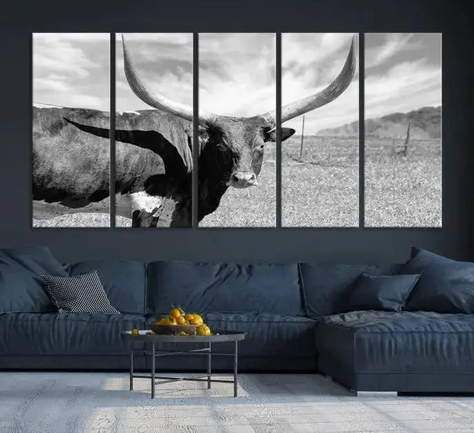 A black and white image of a longhorn cow, expertly divided into three panels, is printed on high-quality poly-cotton canvas. This Cattle Wall Art Longhorn Cow Canvas Print is professionally hand-assembled. Enjoy the ease of free shipping included with your purchase for ultimate convenience.