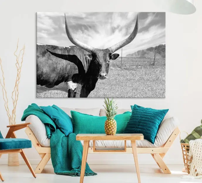 A black and white image of a longhorn cow, expertly divided into three panels, is printed on high-quality poly-cotton canvas. This Cattle Wall Art Longhorn Cow Canvas Print is professionally hand-assembled. Enjoy the ease of free shipping included with your purchase for ultimate convenience.