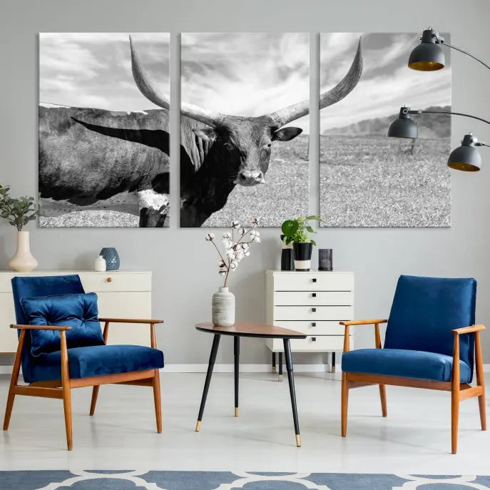 A black and white image of a longhorn cow, expertly divided into three panels, is printed on high-quality poly-cotton canvas. This Cattle Wall Art Longhorn Cow Canvas Print is professionally hand-assembled. Enjoy the ease of free shipping included with your purchase for ultimate convenience.