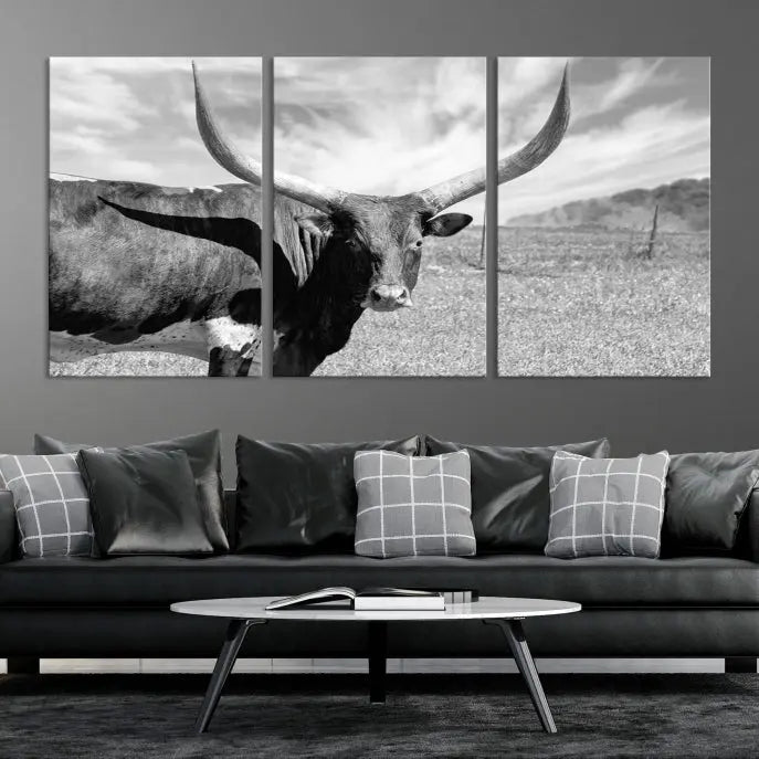 A black and white image of a longhorn cow, expertly divided into three panels, is printed on high-quality poly-cotton canvas. This Cattle Wall Art Longhorn Cow Canvas Print is professionally hand-assembled. Enjoy the ease of free shipping included with your purchase for ultimate convenience.