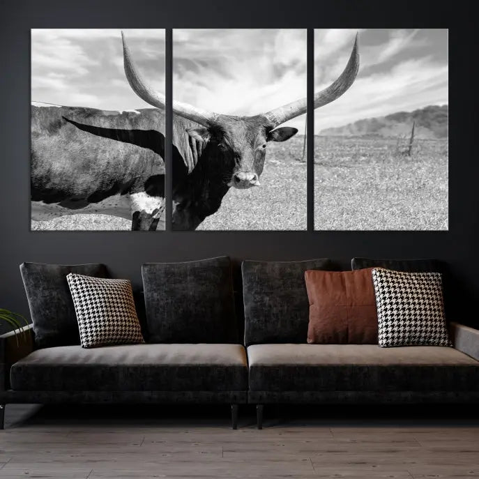 A black and white image of a longhorn cow, expertly divided into three panels, is printed on high-quality poly-cotton canvas. This Cattle Wall Art Longhorn Cow Canvas Print is professionally hand-assembled. Enjoy the ease of free shipping included with your purchase for ultimate convenience.