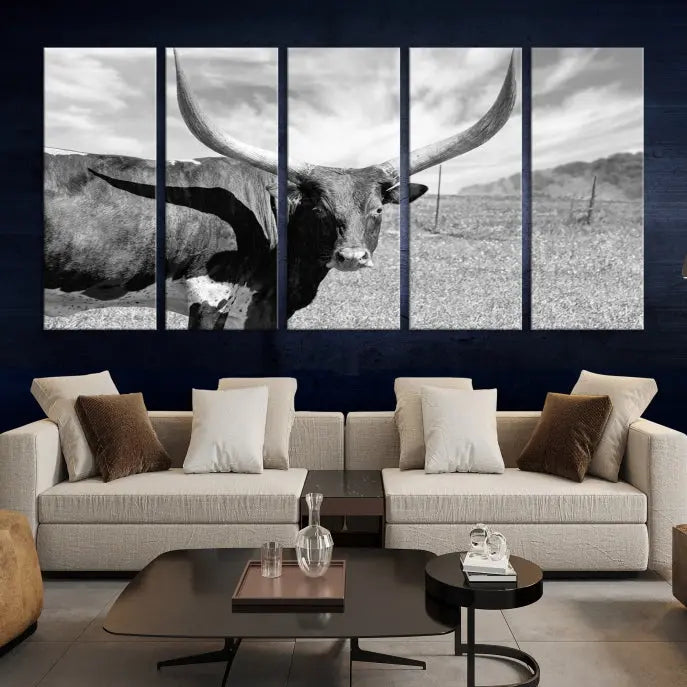 A black and white image of a longhorn cow, expertly divided into three panels, is printed on high-quality poly-cotton canvas. This Cattle Wall Art Longhorn Cow Canvas Print is professionally hand-assembled. Enjoy the ease of free shipping included with your purchase for ultimate convenience.