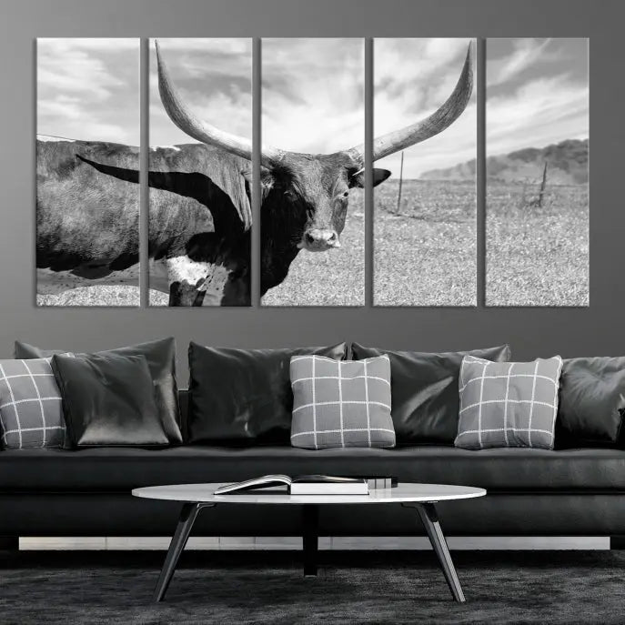 A black and white image of a longhorn cow, expertly divided into three panels, is printed on high-quality poly-cotton canvas. This Cattle Wall Art Longhorn Cow Canvas Print is professionally hand-assembled. Enjoy the ease of free shipping included with your purchase for ultimate convenience.