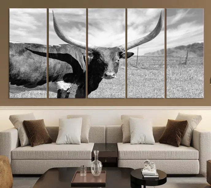 A black and white image of a longhorn cow, expertly divided into three panels, is printed on high-quality poly-cotton canvas. This Cattle Wall Art Longhorn Cow Canvas Print is professionally hand-assembled. Enjoy the ease of free shipping included with your purchase for ultimate convenience.