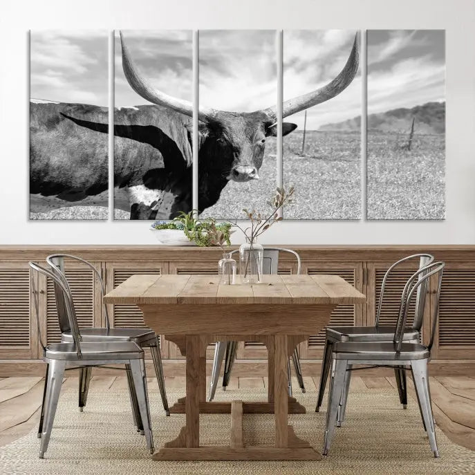 A black and white image of a longhorn cow, expertly divided into three panels, is printed on high-quality poly-cotton canvas. This Cattle Wall Art Longhorn Cow Canvas Print is professionally hand-assembled. Enjoy the ease of free shipping included with your purchase for ultimate convenience.