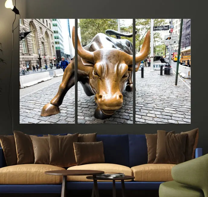 A living room showcases a triptych of the Charging Bull Wall Art Canvas Print on museum-quality canvas.