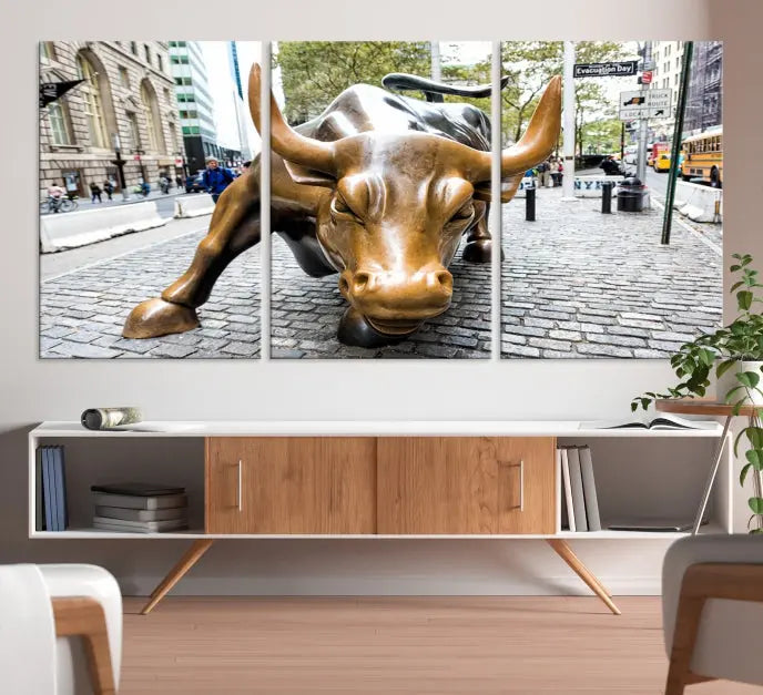 A living room showcases a triptych of the Charging Bull Wall Art Canvas Print on museum-quality canvas.