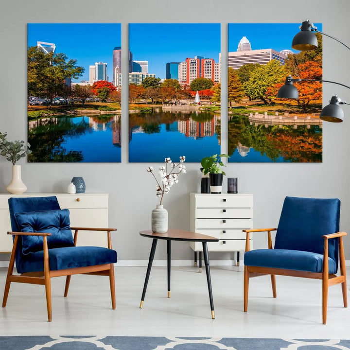 The "Charlotte City Autumn Morning Blue Skyline Cityscape View Wall Art Canvas Print" showcases a cityscape with vibrant autumn trees reflected in a lake. Its gallery-wrapped edges add depth to the scene, while the UV-protective coating ensures lasting brilliance.