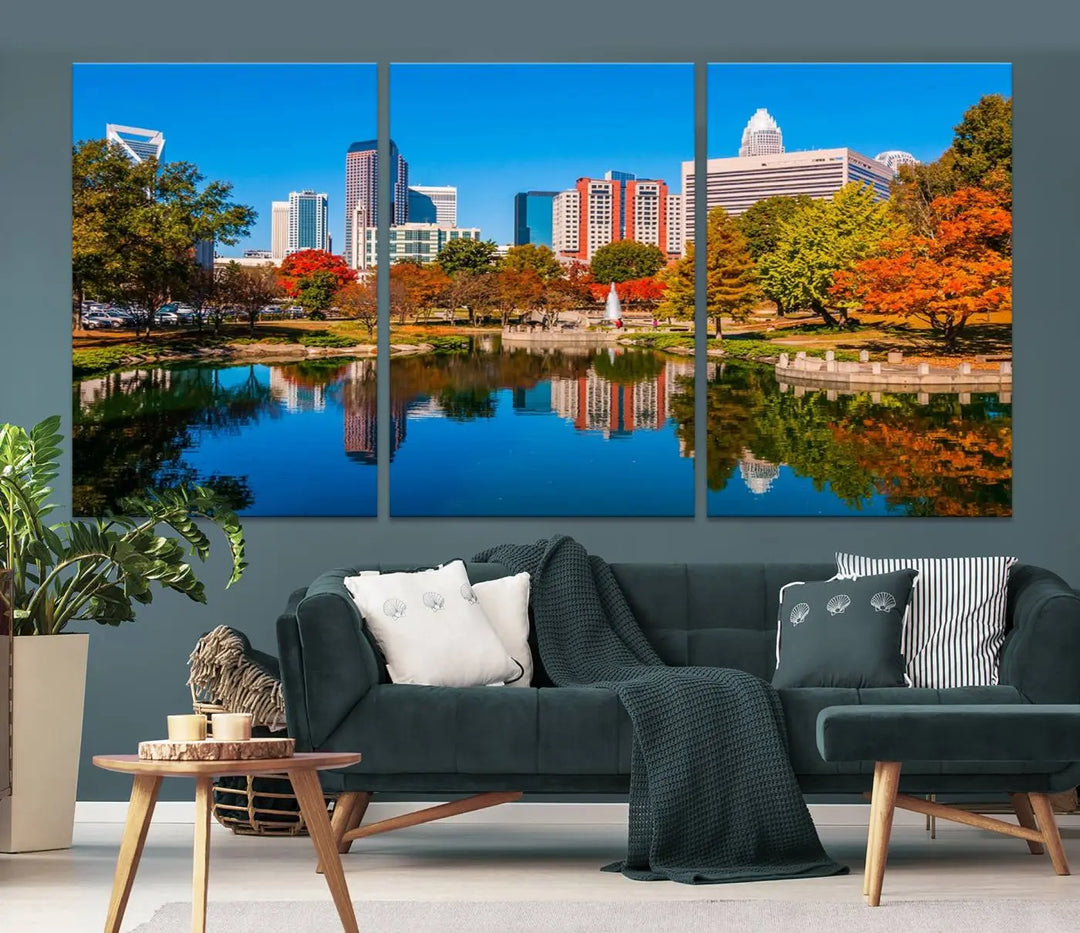 The "Charlotte City Autumn Morning Blue Skyline Cityscape View Wall Art Canvas Print" showcases a cityscape with vibrant autumn trees reflected in a lake. Its gallery-wrapped edges add depth to the scene, while the UV-protective coating ensures lasting brilliance.