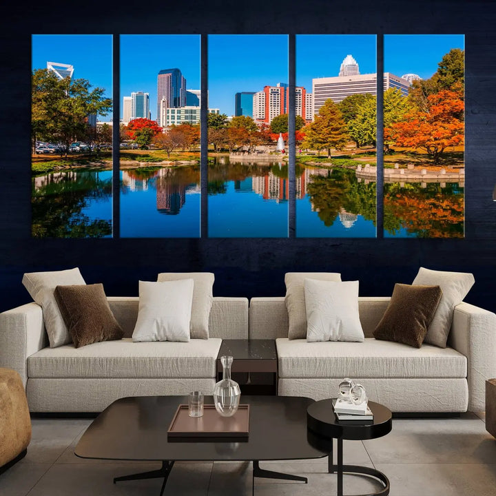 The "Charlotte City Autumn Morning Blue Skyline Cityscape View Wall Art Canvas Print" showcases a cityscape with vibrant autumn trees reflected in a lake. Its gallery-wrapped edges add depth to the scene, while the UV-protective coating ensures lasting brilliance.