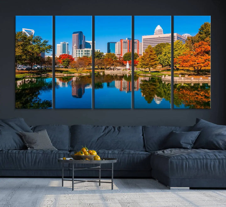 The "Charlotte City Autumn Morning Blue Skyline Cityscape View Wall Art Canvas Print" showcases a cityscape with vibrant autumn trees reflected in a lake. Its gallery-wrapped edges add depth to the scene, while the UV-protective coating ensures lasting brilliance.