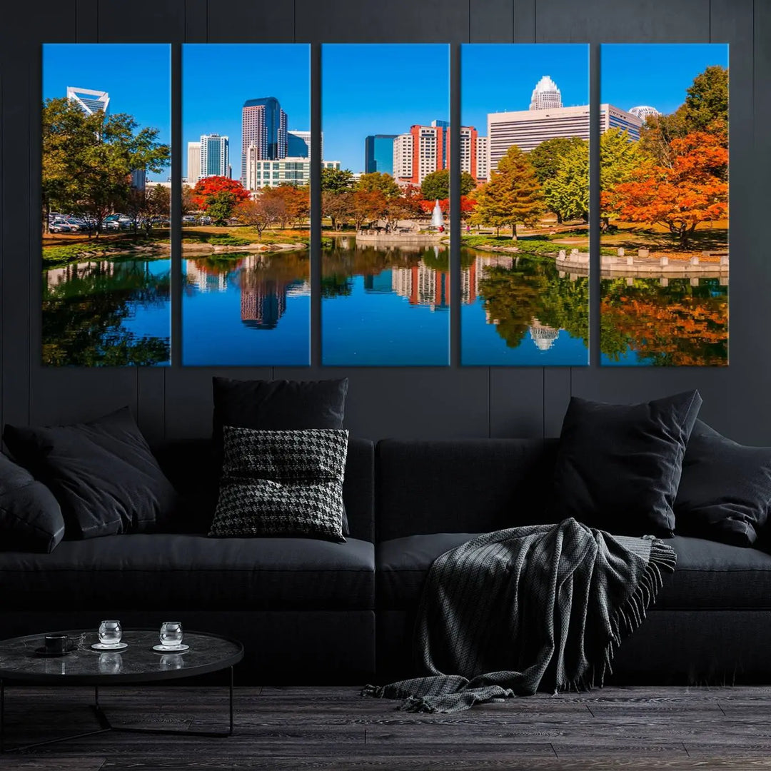 The "Charlotte City Autumn Morning Blue Skyline Cityscape View Wall Art Canvas Print" showcases a cityscape with vibrant autumn trees reflected in a lake. Its gallery-wrapped edges add depth to the scene, while the UV-protective coating ensures lasting brilliance.