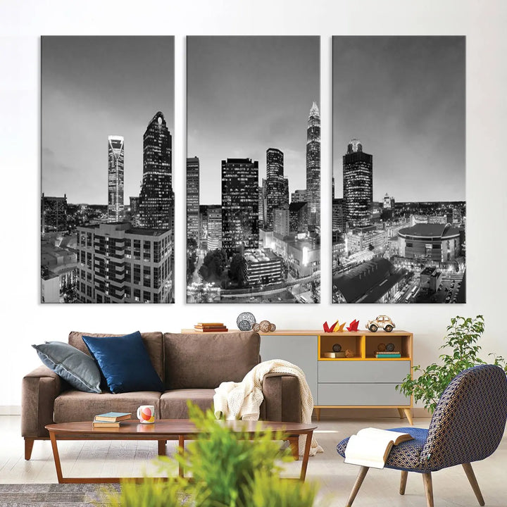 The "Charlotte City Cloudy Skyline Black and White Wall Art Cityscape Canvas Print" hangs on a dark wall, showcasing its UV-protective properties for enduring beauty.